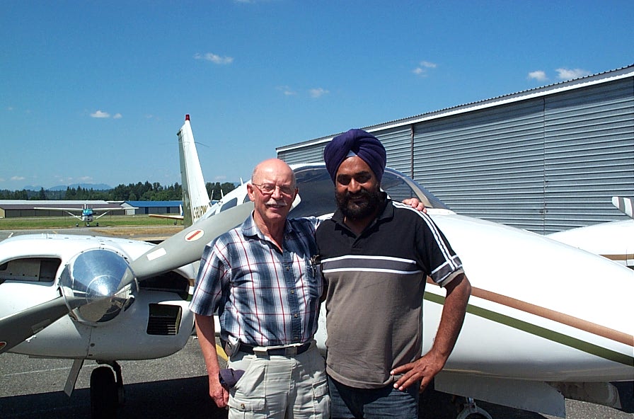 Gurpreet Mangat with Pilot Examiner Donn Richardson after the completion of Gurpreet's Multi-engine Class Rating Flight Test.  Langley Flying School.